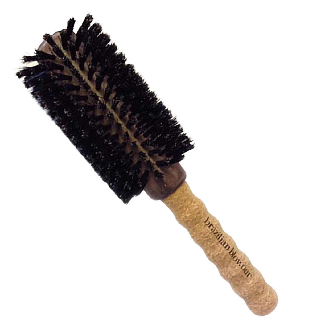 A Brazilian Blowout Boar Bristle Hair Brush with a wooden handle on a black background.