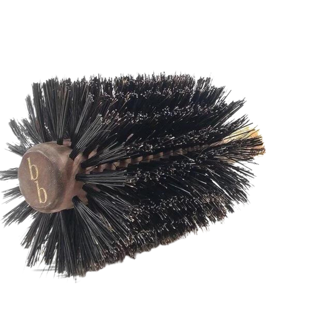 A Brazilian Blowout Boar Bristle Hair Brush on a black background.