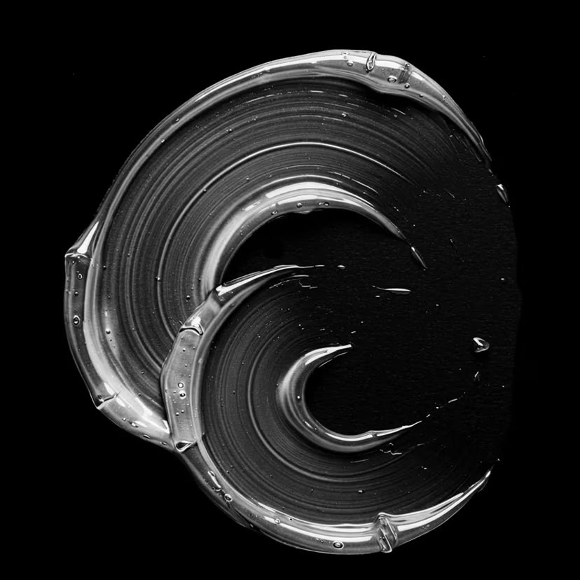 Metallic spiral design on a black background