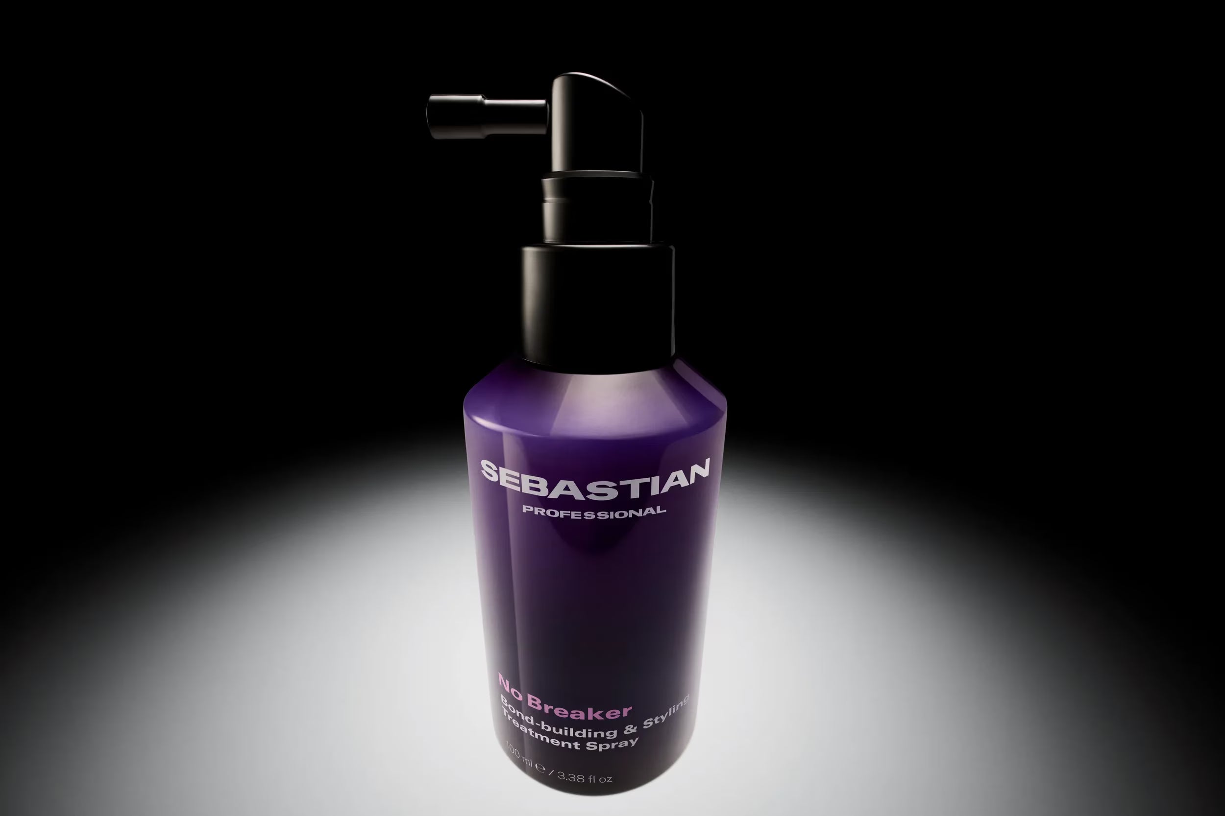 Purple bottle of Sebastian Professional hair product on a black background