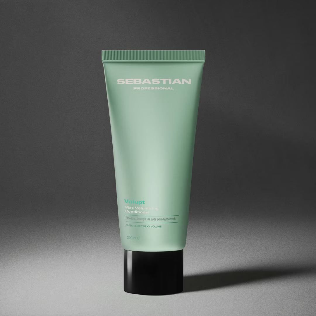Green tube of Sebastian hair product on a gray background