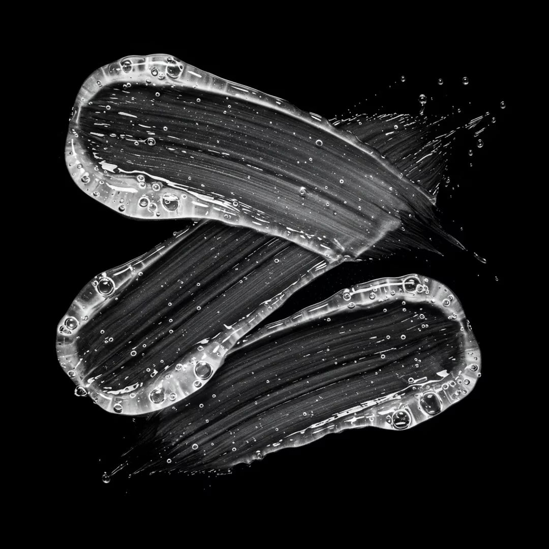 Black and white brush strokes on a black background