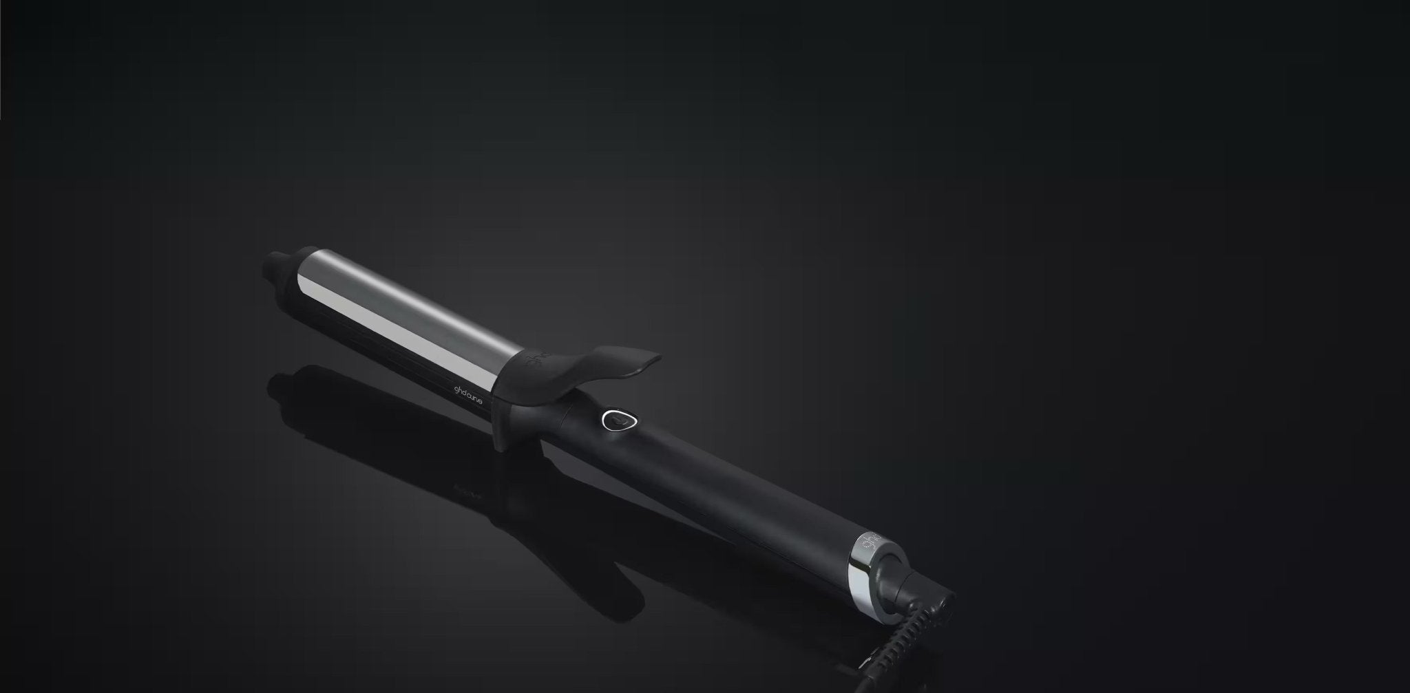 Hair straightener on a black background