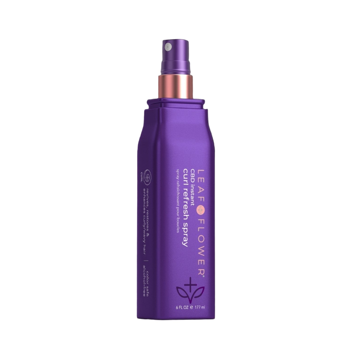 A purple Leaf and Flower Instant Curl Refresh Spray bottle with a spray nozzle and copper accent, featuring product details and branding, stands upright against a light beige background.