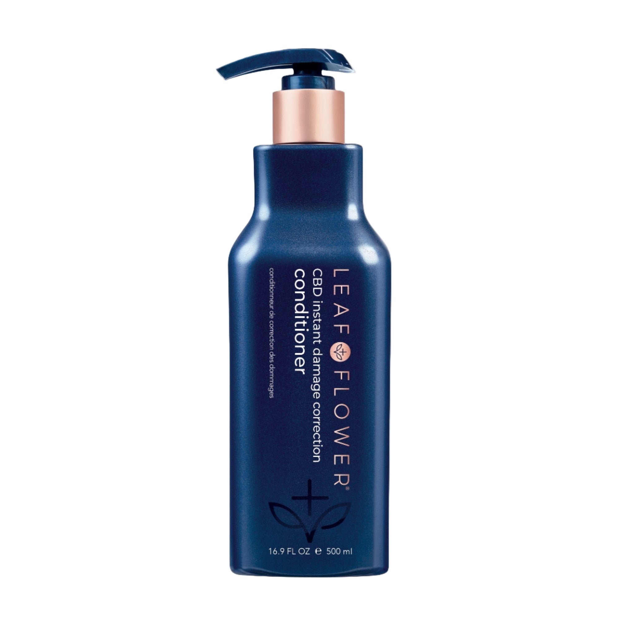 A blue bottle of Leaf and Flower Damage Correction Conditioner is displayed on a plain light background. This cruelty-free, plant-based formula helps instantly repair and restore hair. Multiple sizes available.