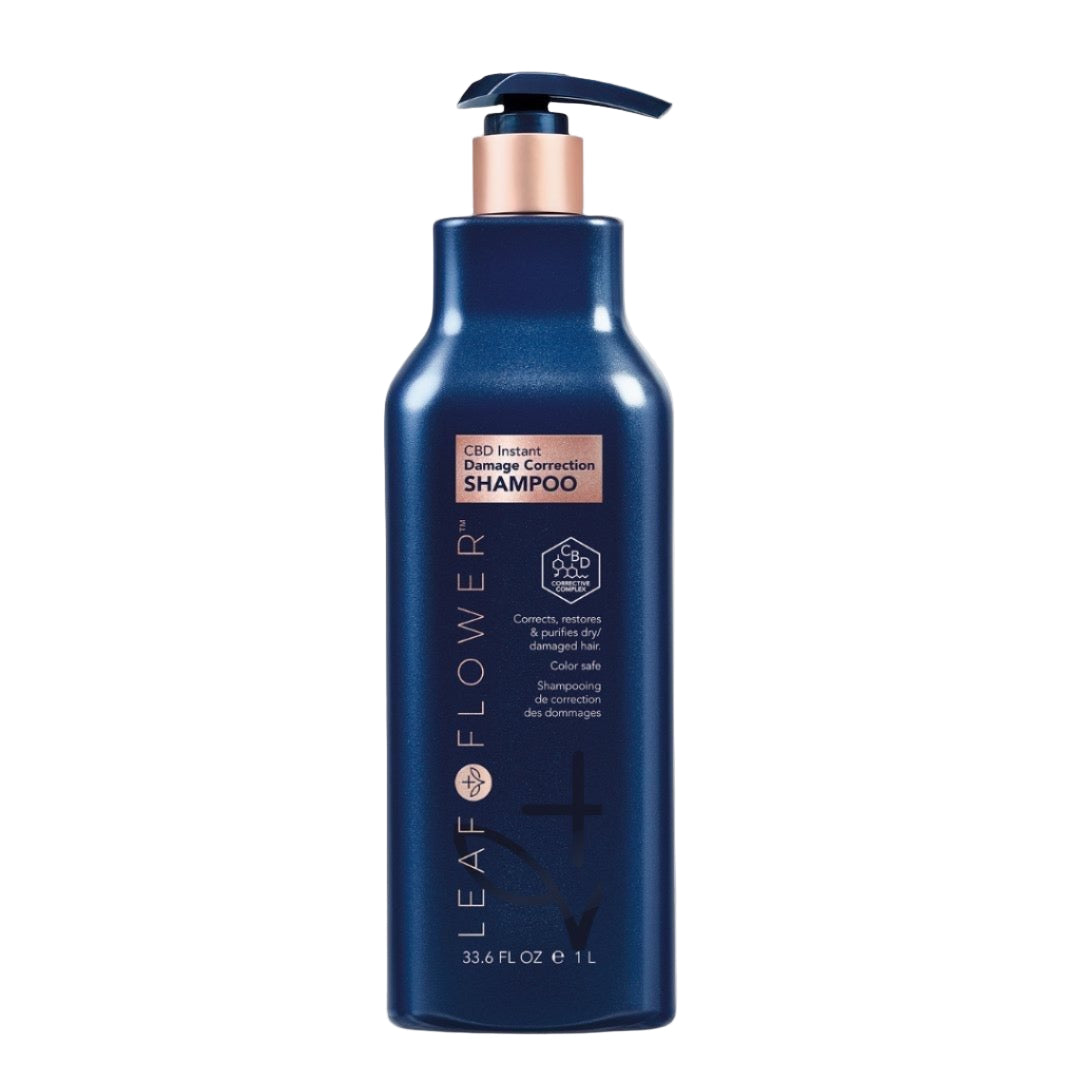 A 1-liter blue bottle of Leaf and Flower Damage Correction Shampoo with a pump and rose gold accents sits on a beige background. The label features its color-safe formula and product info in English and French. MULTIPLE SIZES AVAILABLE.