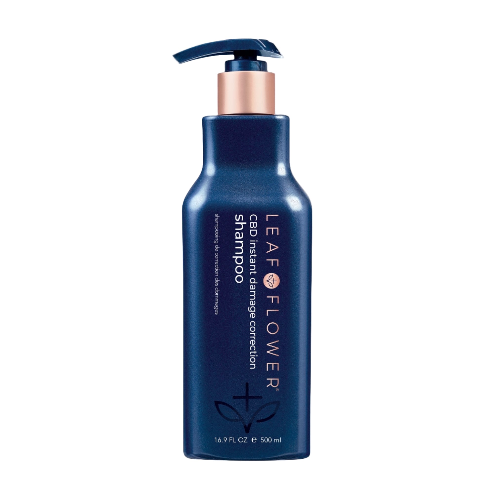 A blue 16.9 fl oz (500 ml) bottle of Leaf and Flower Damage Correction Shampoo with a black pump, copper accents, and white text. This color-safe formula helps control frizz; multiple sizes available.