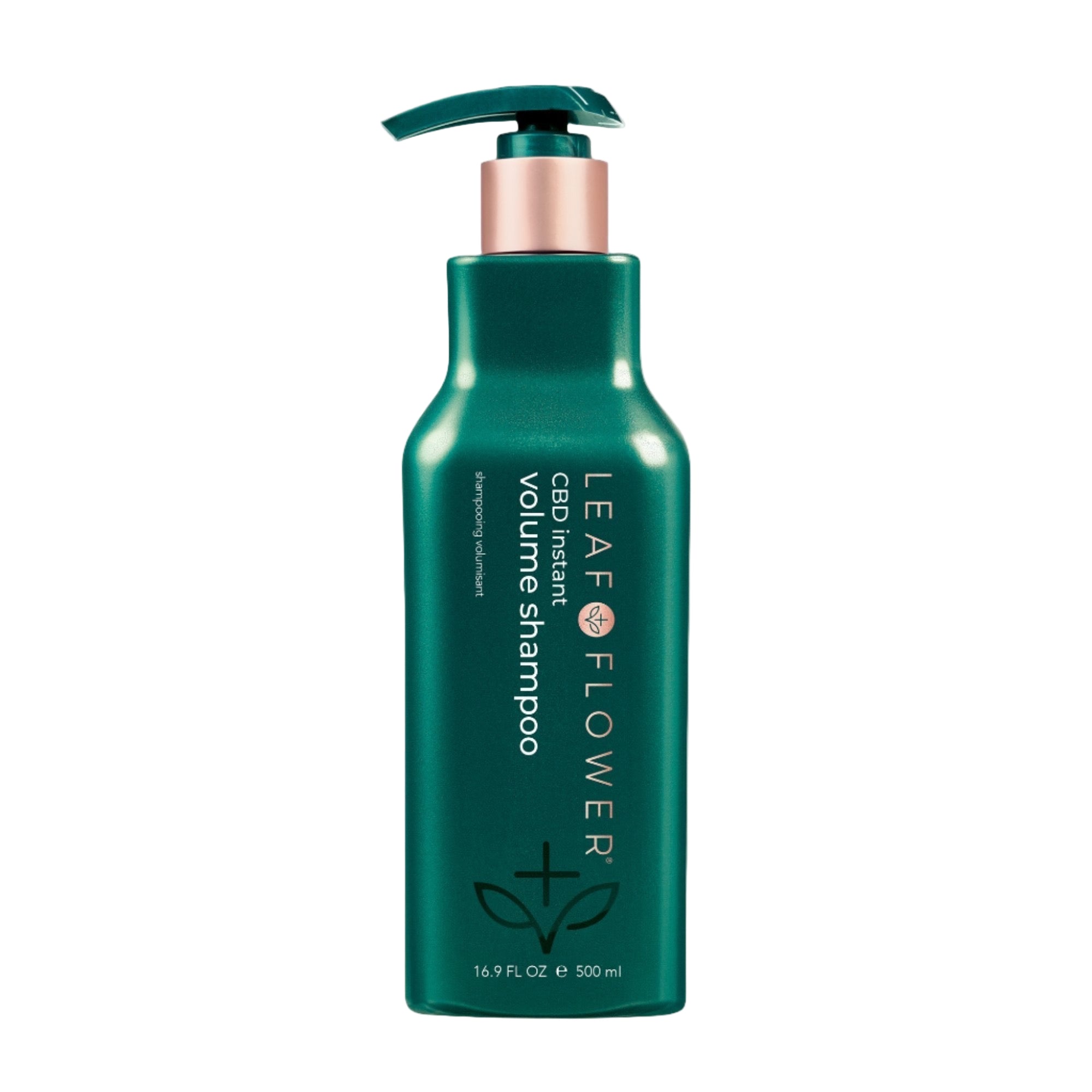 A green pump bottle of Leaf and Flower Instant Volume Shampoo, featuring white and bronze accents, vertical sulfate-free info, and available in multiple sizes.