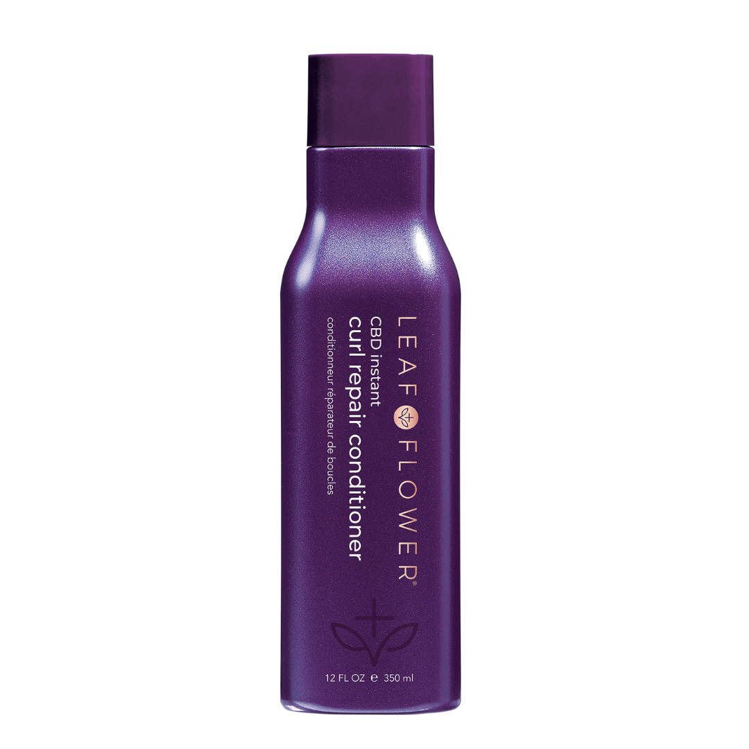 A purple bottle of Leaf and Flower Instant Curl Repair Conditioner for all curl types.