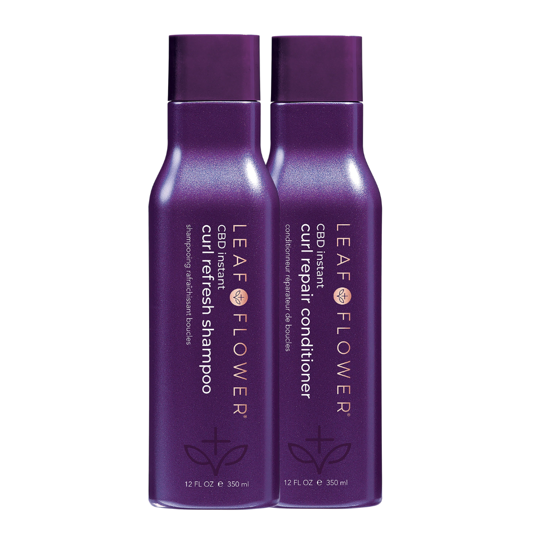 Two bottles of Leaf & Flower Instant Curl Repair Shampoo and Conditioner Duo, designed for hydration, against a white background.