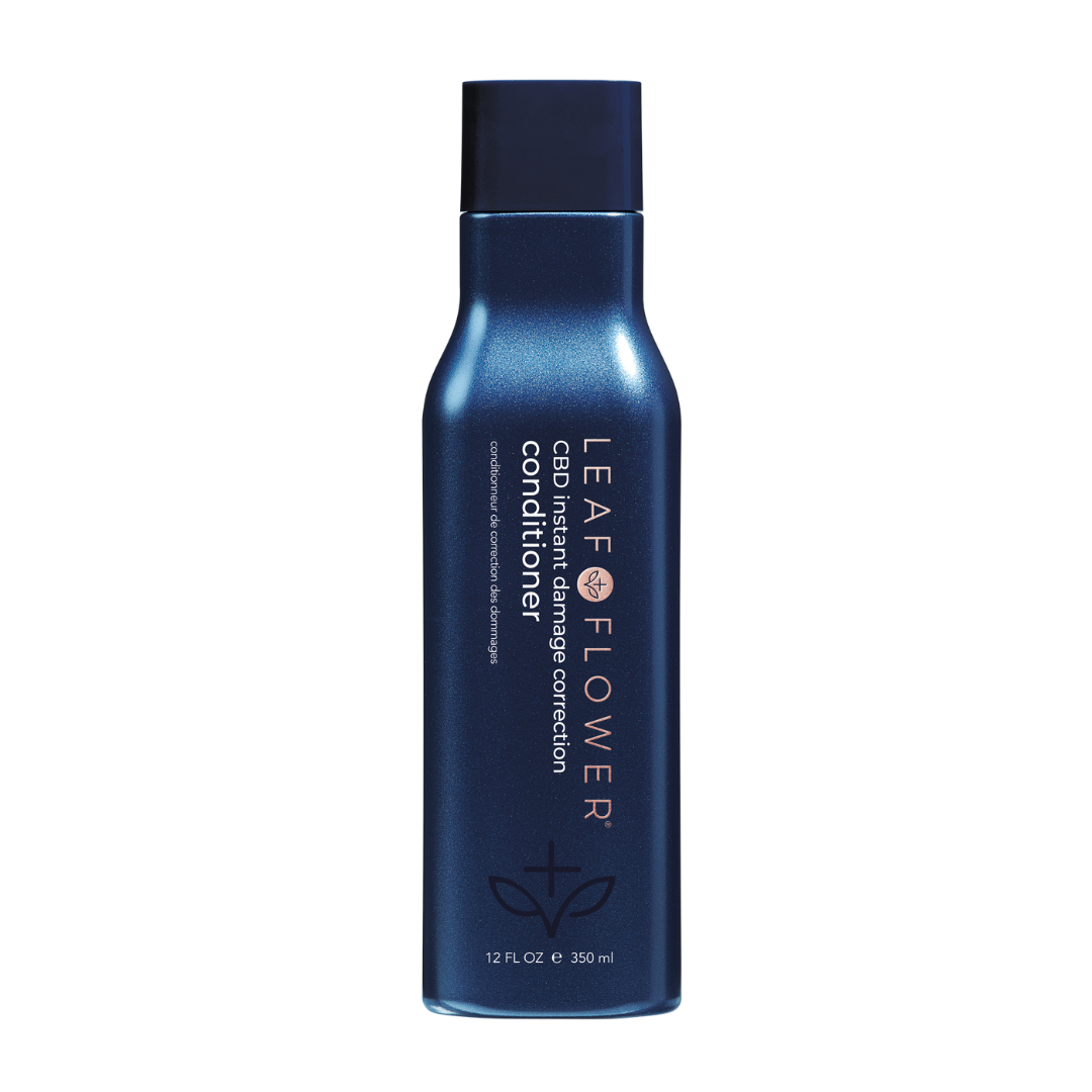 A bottle of hair conditioner for Leaf and Flower, the Leaf and Flower Damage Correction Conditioner.