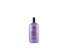 A bottle of Oligo Blacklight Blue Shampoo on a black background.