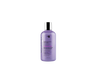 A bottle of Oligo Blacklight Violet Shampoo for blonde hair targeting yellow tones.