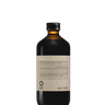 A 240 ml dark glass bottle with a gold cap labeled "Oway Bluemoon Hair Bath | Illuminating Anti-Yellow Shampoo for Cool Blonde, White & Grey Hair" by Oway, designed to neutralize brassiness. The label features text in multiple languages.