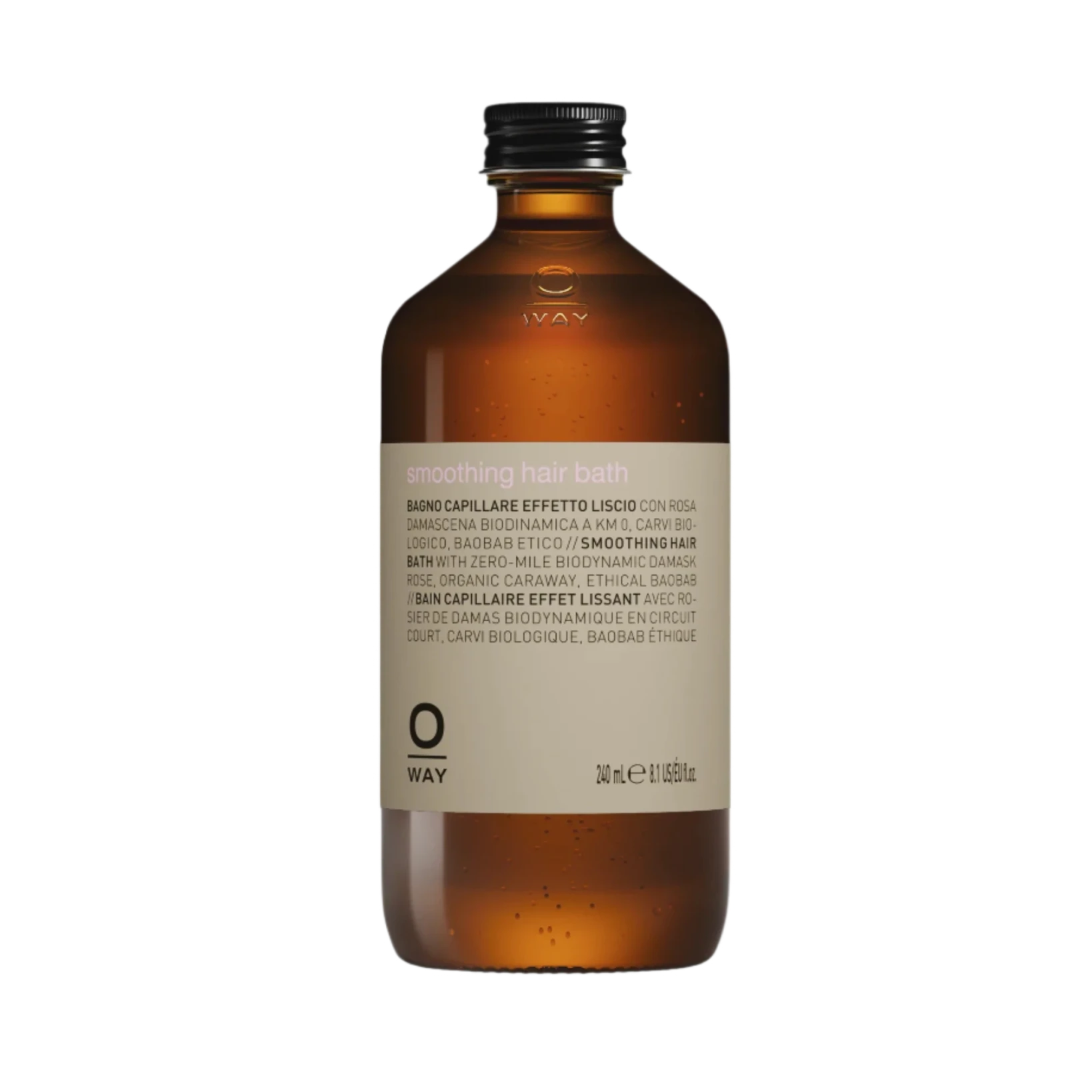 The Oway Smoothing Hair Bath is a 240 ml brown glass bottle with a black screw cap. Formulated with biodynamic caraway, this frizz-control shampoo for coarse or unruly hair features multilingual product info.