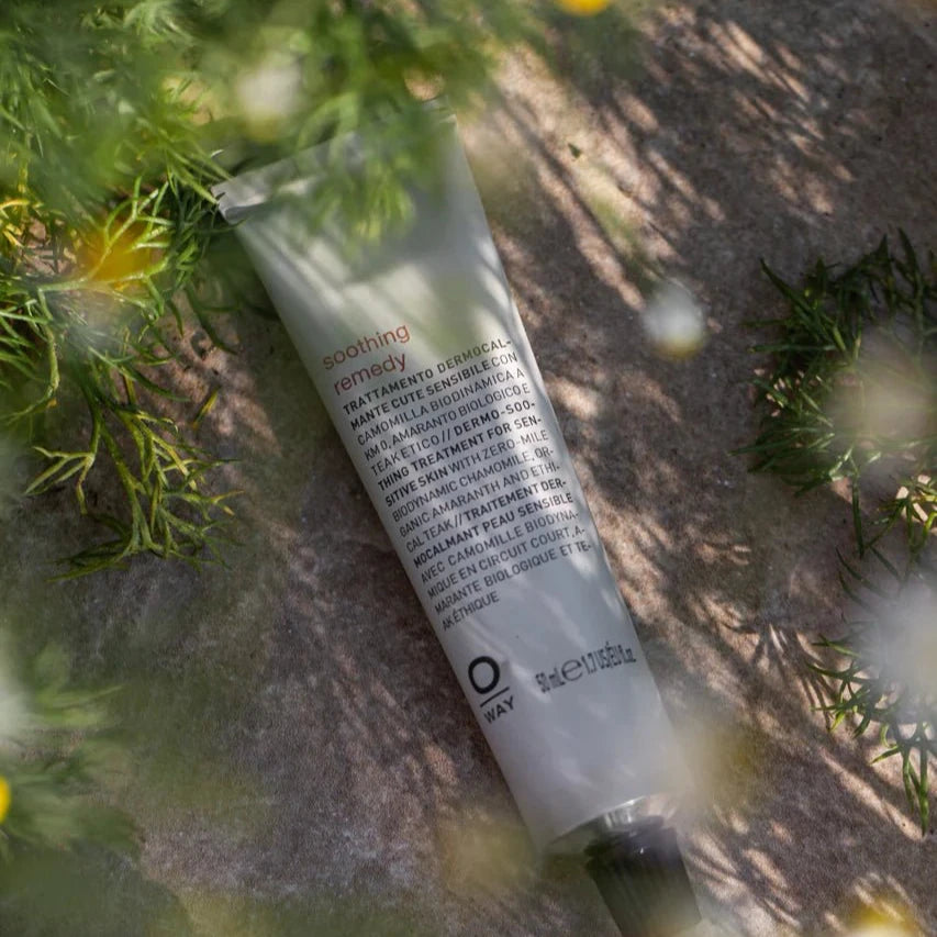 Skincare tube on a natural background with greenery