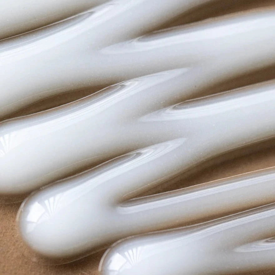 Close-up of white gloves on a brown background