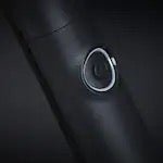 Close-up of a car's air vent with a dark background