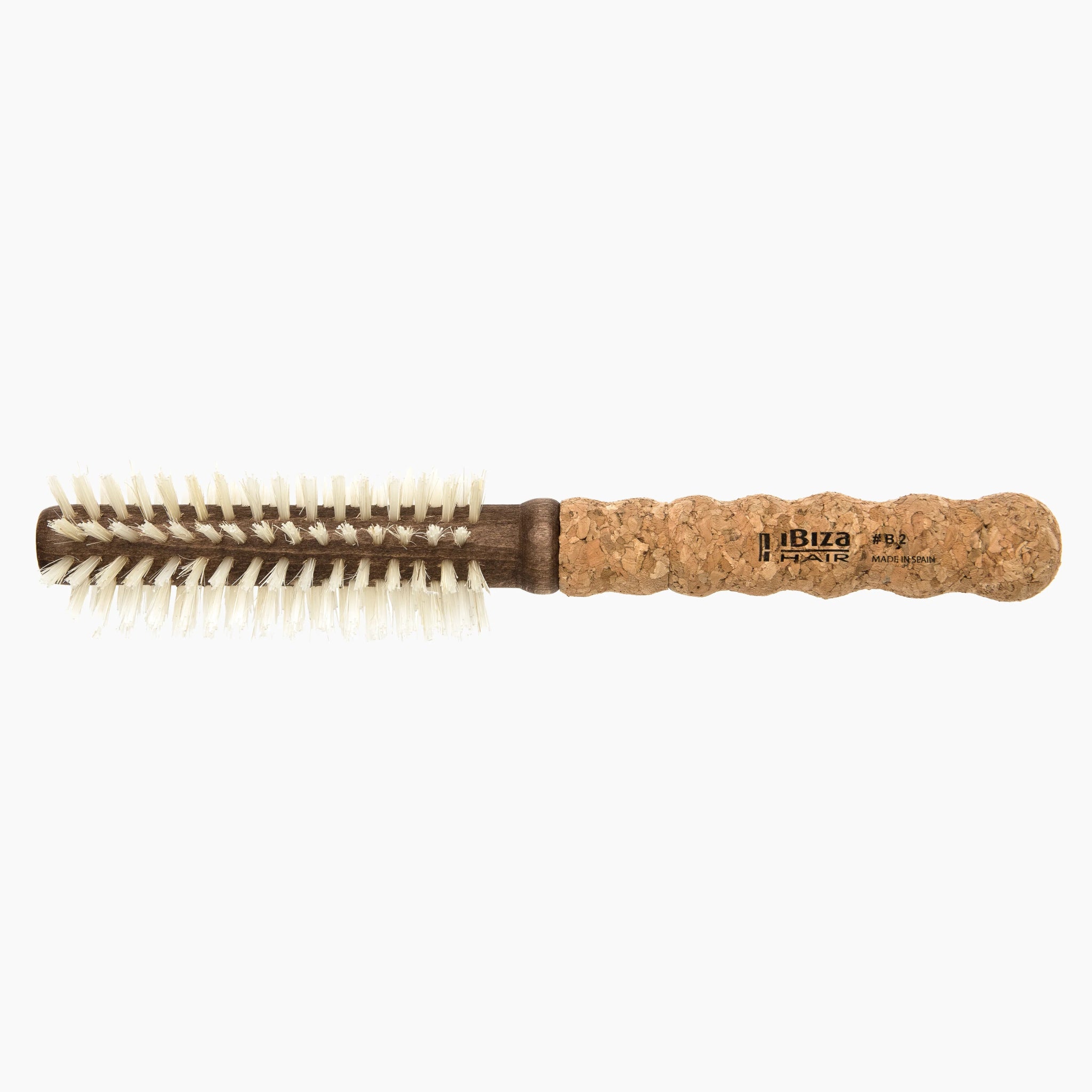 Round brush with cork handle on a white background