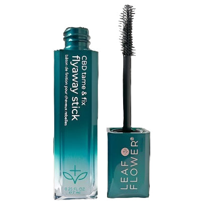 A teal Leaf and Flower Tame & Fix Flyaway Stick is shown with its cap off, revealing a curved mascara-style brush. The label highlights its plant-based CBD Corrective Complex for smooth, controlled hair.
