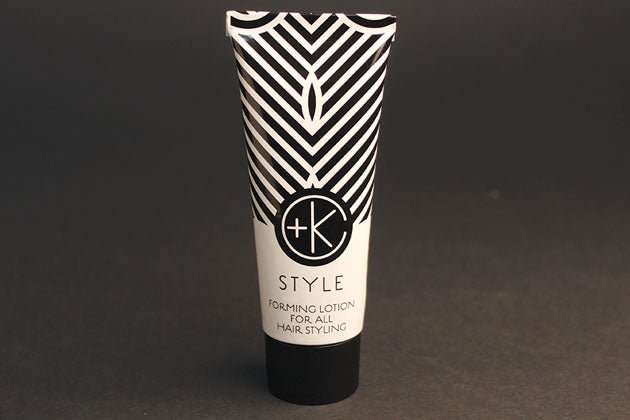 A tube of Cult and King STYLE | Forming Lotion for all Hair Styling with a black and white pattern for styling.