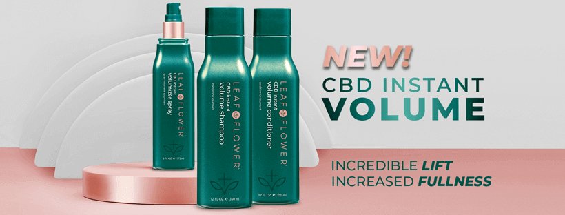 Four green bottles of Leaf and Flower stand on a pink platform with white arches. NEW! LEAF and FLOWER Instant Volume Shampoo and Conditioner Duo—vegan-friendly, ideal for fine hair seeking lift and fullness.
