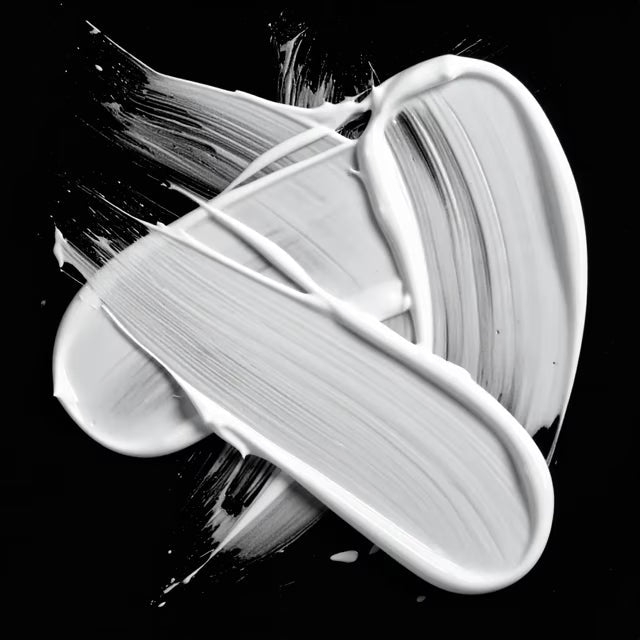A smear of Drench Hydrate Mask on a black background.