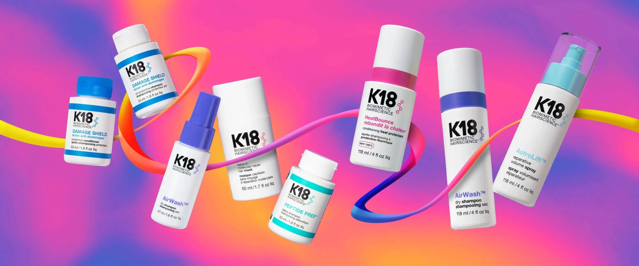 K18 haircare floating with a ribbon on a pink and purple backdrop