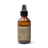 A 100 ml brown glass bottle with a black pump labeled "Oway Silk’N Glow Serum | Anti-Frizz Shine Serum for Dry, Frizzy Hair," enriched with biodynamic oat and Brazil nut oil.