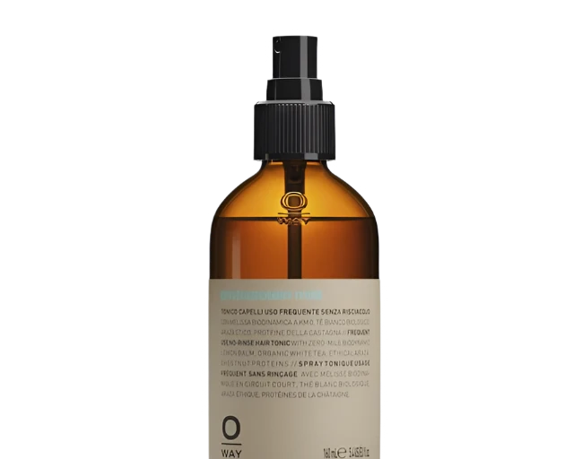 A brown glass spray bottle with a black nozzle and beige label containing Oway Phytoprotein Mist, a leave-in treatment to strengthen fragile hair and prevent breakage.
