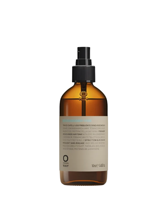 A brown glass spray bottle with a black nozzle and beige label containing Oway Phytoprotein Mist, a leave-in treatment to strengthen fragile hair and prevent breakage.
