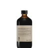 A 240 ml dark glass bottle with a gold cap labeled "Oway Bluemoon Hair Bath | Illuminating Anti-Yellow Shampoo for Cool Blonde, White & Grey Hair" by Oway, designed to neutralize brassiness. The label features text in multiple languages.