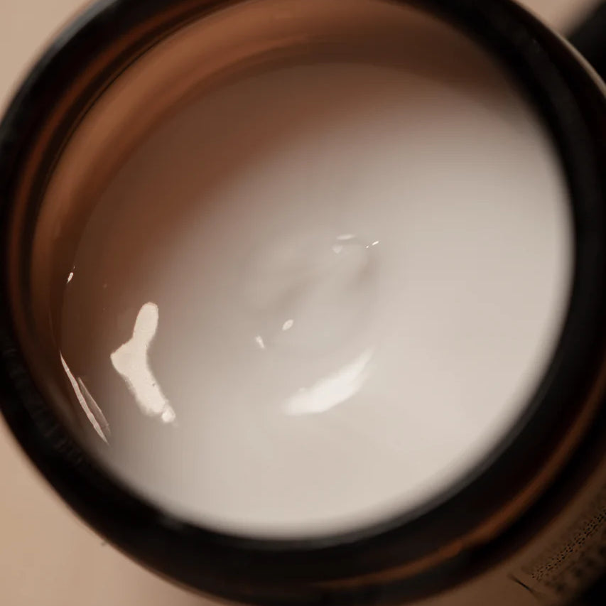 An open jar of Oway Boho Pomade | Texturizing Cream Pomade reveals a smooth, matte paste inside—ideal for flexible hold and effortless, laid-back hair styling by Oway.
