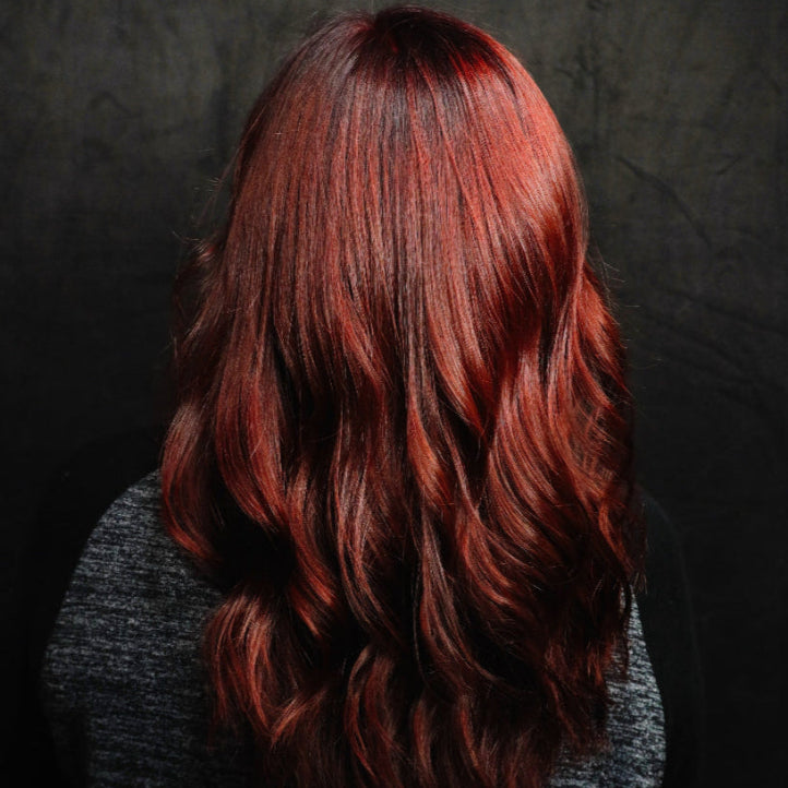 Red hair with a dark background