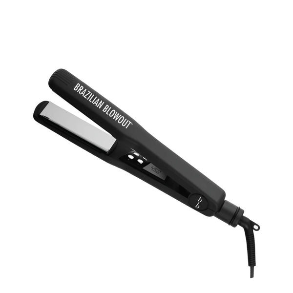 The Brazilian Blowout 1 1/4 Inch Flat Iron by Simply Colour Hair Salon Studio & Online Store features titanium plates, a digital temperature display, and a base-attached power cord for frizz-free styling results.