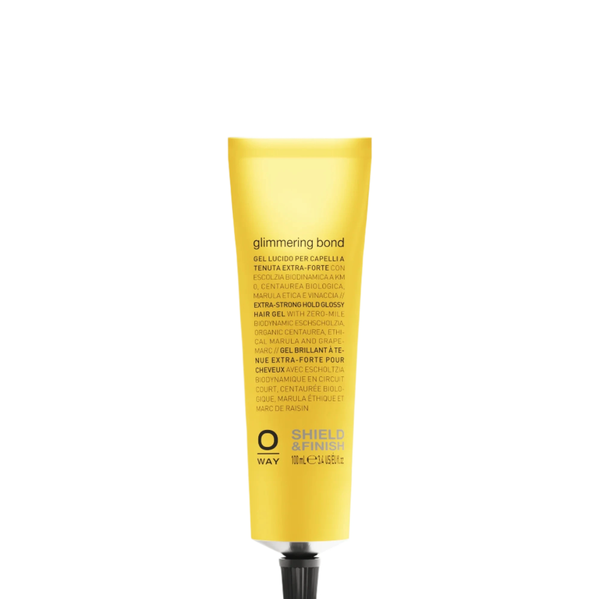 A yellow tube of Oway Glimmering Bond | Bonding Shine Treatment for Damaged, Dull Hair stands upright on a dark textured background, formulated with ethical marula oil for extra care and shine.
