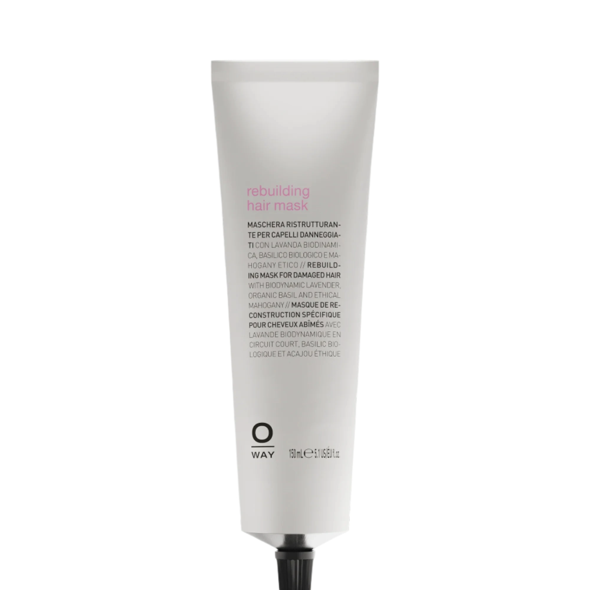 A white tube of Oway Rebuilding Hair Mask | Restorative Mask for Damage and Instant Repair, labeled with its use for damaged or chemically treated hair, is shown against a black textured background.