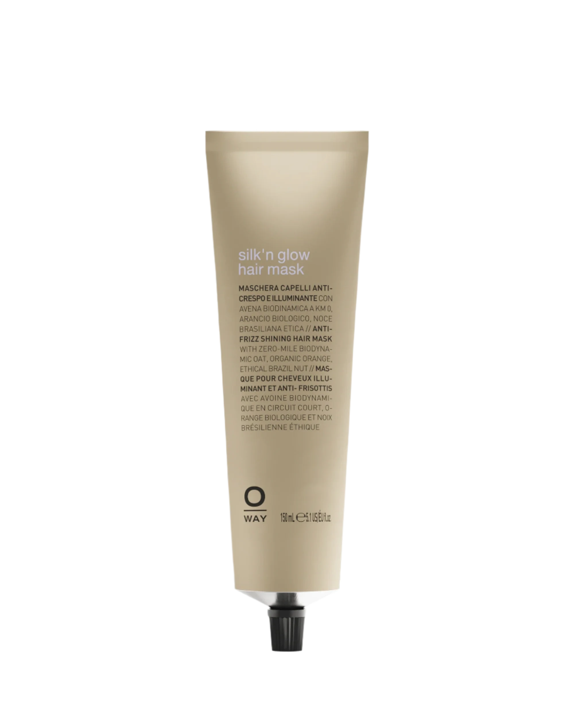 A beige tube of Oway Silk’N Glow Hair Mask for dry, frizzy hair with a black cap is displayed against a dark textured background. The label features product details in various languages.