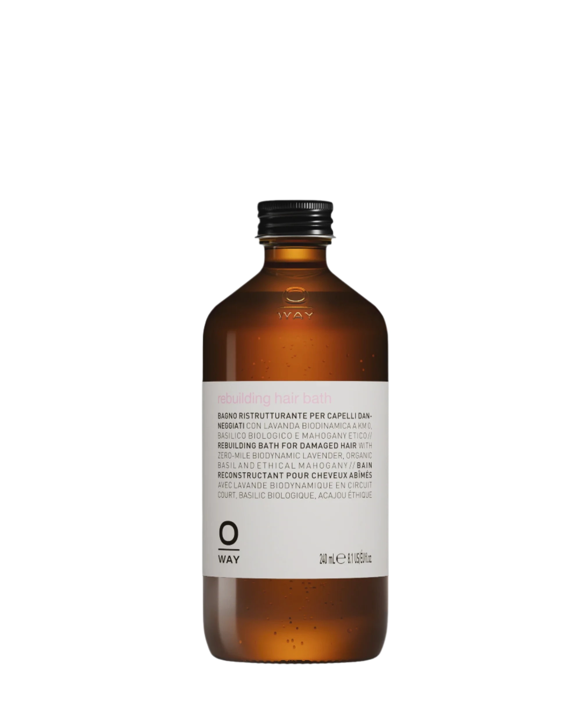 A 240ml brown glass bottle labeled “Oway Rebuilding Hair Bath | Strengthening Shampoo for Brittle, Weak Hair” by Oway features a black screw cap and plant-derived keratin to strengthen damaged hair.