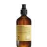 A 240 ml brown glass bottle of Oway Sculpting Mist | Long-Lasting Finishing Spray with Flexible Hold is shown against a black textured background, ideal for perfecting your finishing spray routine with flexible hold and humidity control.
