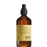 Oway Sea Salt Spray | Beachy Texture Spray for Tousled Waves comes in an amber bottle with a black spray nozzle and yellow label, ideal for creating tousled waves and beachy texture.