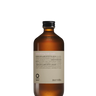 Clear glass bottle with brown cap featuring a beige label and 240 ml of Oway Smoothing Hair Bath | Frizz-Control Shampoo for Coarse or Unruly Hair, enriched with biodynamic caraway extract.