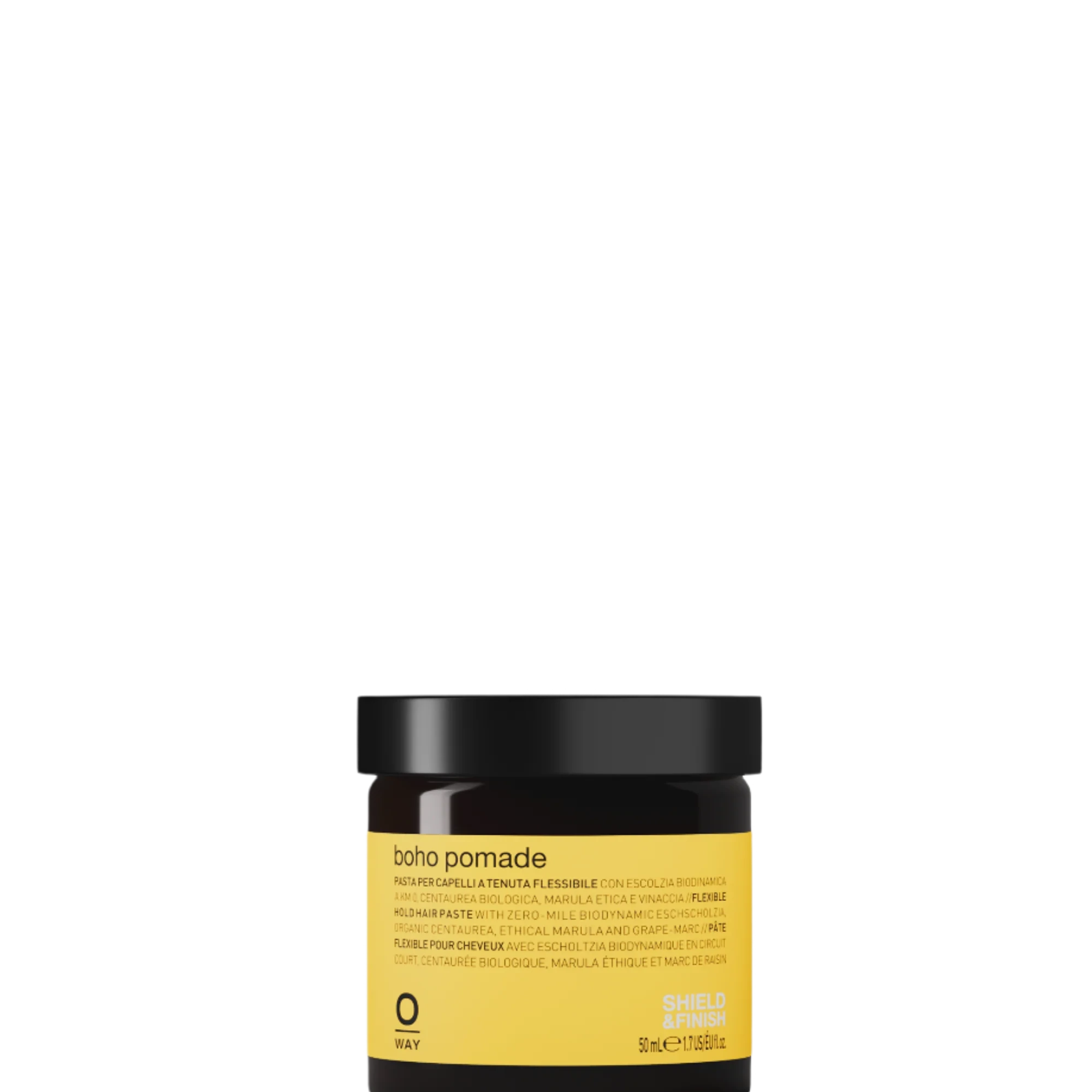 A small amber jar with a black lid labeled “Oway Boho Pomade” rests on a dark textured surface, offering a laid-back, matte finish with flexible hold.