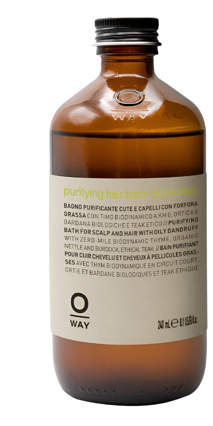A 240 ml brown glass bottle of Oway Purifying Hair Bath for Oily Scalp, featuring multilingual front labeling. An organic shampoo by Oway, ideal for gently clarifying and balancing oily scalps.