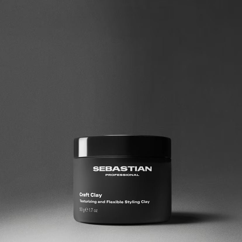Black jar of Sebastian Professional Craft Clay on a gray background