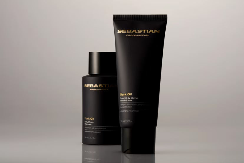 Two Sebastian hair care products on a gray background