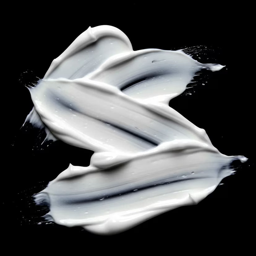 Sebastian Dark Oil Smooth and Shine Conditioner white swirls on a black background.