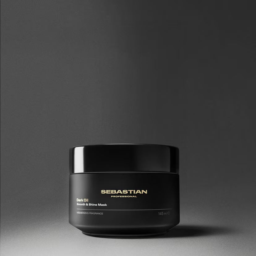 Black jar of Sebastian Professional hair mask on a gray background