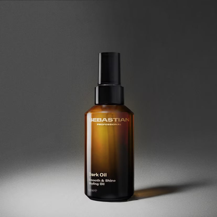 Bottle of Sebastian Dark Oil on a gray background