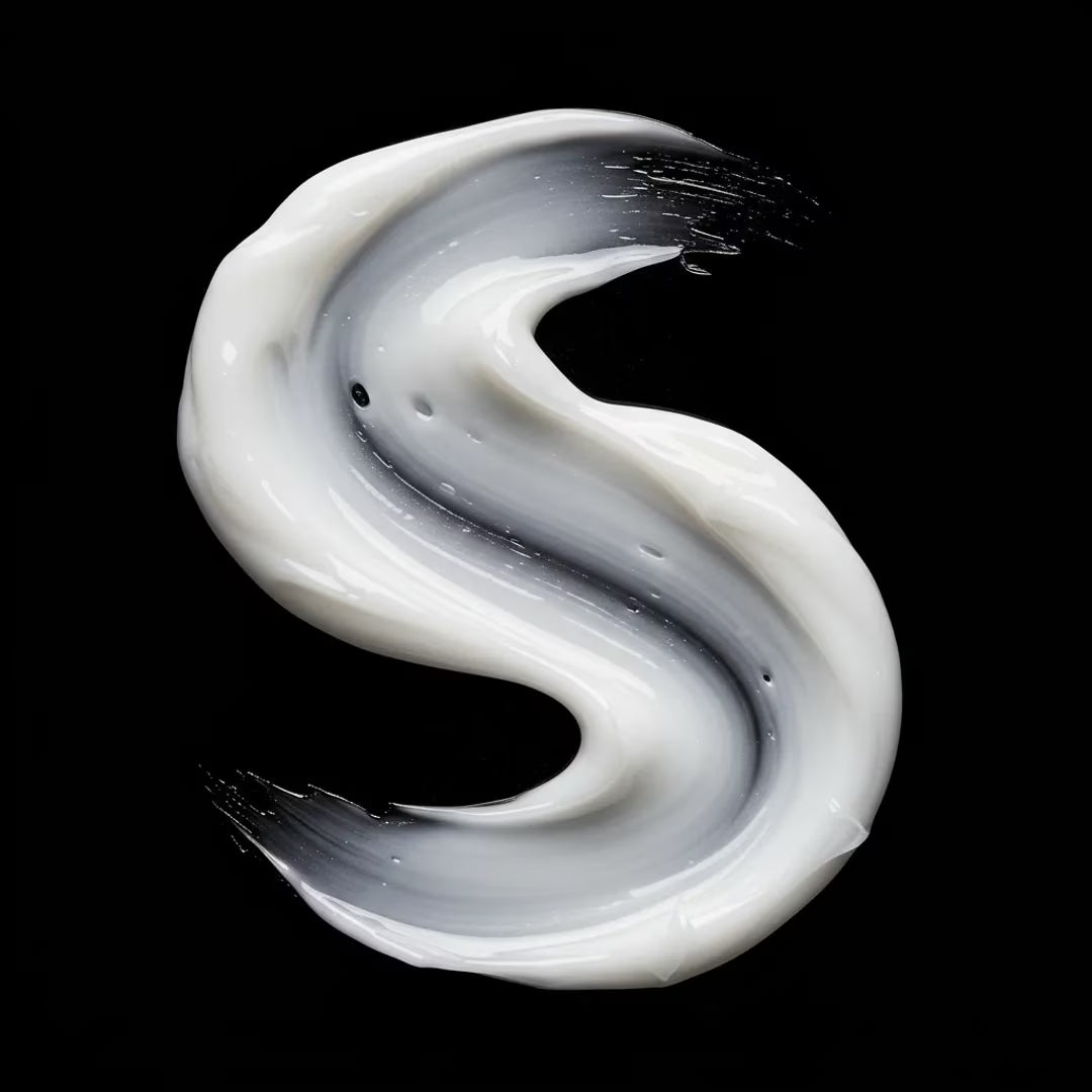White cream swirl on a black background